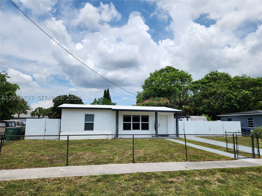 Photo of 721 NW 33rd Ave, Lauderhill, FL 33311 (MLS # A12036737)