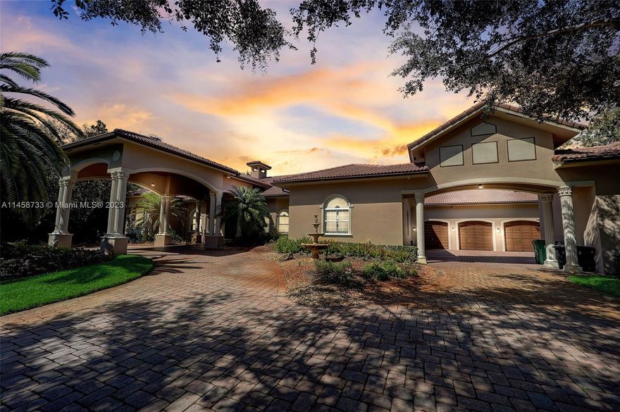 Step inside this luxurious property and be greeted by the impressive vaulted ceilings which create an open and spacious feel. This home has 4870 square feet of living space with 5 bedrooms 4.5 bathrooms, a 3 car garage with another detached garage for your golf cart. The theatre room and billiard room provide additional spaces for entertainment, while the sauna offers a luxurious escape for relaxation.Situated on almost 2 acres of land, this property offers a serene and private setting. The outdoor space is truly a retreat, with a heated saltwater pool and lush, mature landscaping and a summer kitchen. A built-in generator is included to power the entire house in case of a power outage. Bose surround sound speakers throughout the home and several security cameras for added protection.