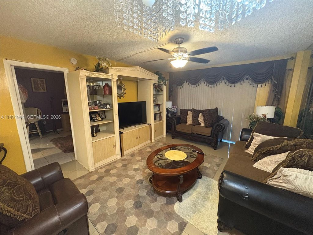 Photo of 4152 Inverrary Dr #303, Lauderhill, FL 33319 (MLS # A11991994)