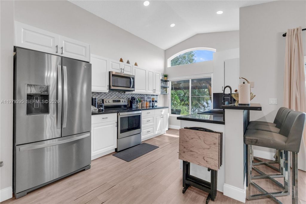 Photo of 9900 S Grand Duke Cir, Tamarac, FL 33321 (MLS # A11979295)