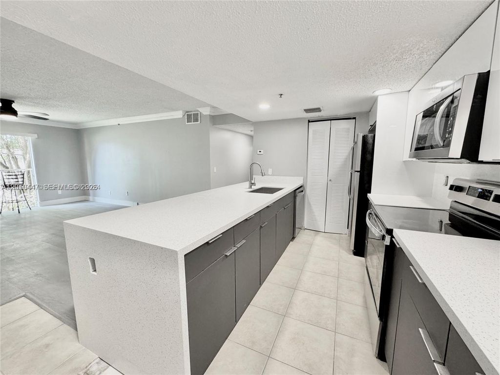 Photo of 9907 Westwood Dr #24-2, Tamarac, FL 33321 (MLS # A12010447)
