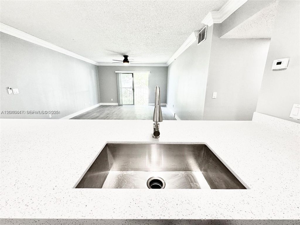 Photo of 9907 Westwood Dr #24-2, Tamarac, FL 33321 (MLS # A12010447)