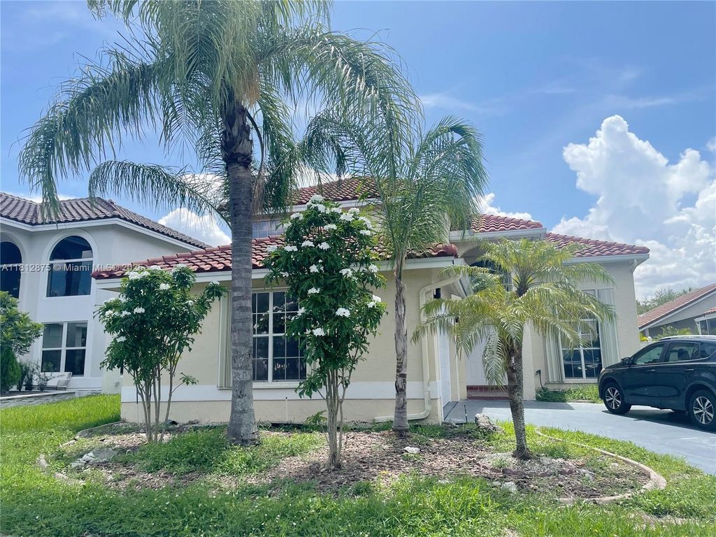 Photo of 1320 NW 185th Ave, Pembroke Pines, FL 33029 (MLS # A11812875)