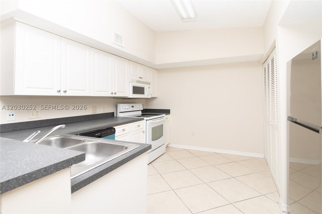 Photo of 9650 NW 2nd St #4-304, Pembroke Pines, FL 33024 (MLS # A12030252)