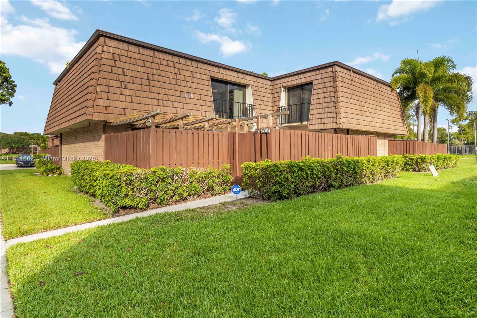 Assumable FHA Loan at 2.75% interest! Incredible opportunity for qualified buyers to take advantage of this low-rate financing. Spacious 3bed, 3 FULL-bath townhome, featuring a 1st-floor bedroom w/ full bath. Open concept layout w/ tile flooring throughout & freshly painted. High Impact windows/sliders on both levels add peace of mind & energy efficiency. The primary suite has 2 closets including walk-in, & access to a private balcony w/ serene lake views. Step outside to your private fenced courtyard—ideal for entertaining. Pet-friendly, all-ages community w/ heated pool, playgrounds, tennis, pickleball, basketball & racquetball courts. 2 assigned parking spaces in front of the unit. HOA covers roof & exterior. Close to beaches, shopping, dining, I-95, Turnpike & PBA.