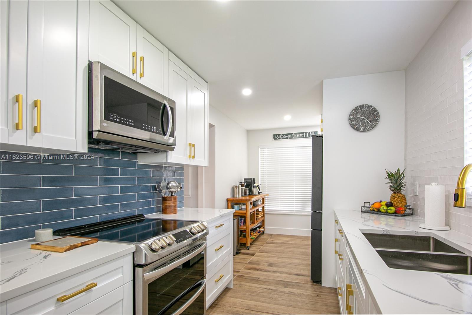 A charming and beautiful 2/2 apartment of 1,070 sqft. Located on a corner, this apartment enjoys a beautiful lake view with gorgeous sunsets. In an open concept rests a renovated kitchen with brand new smart appliances. Quartz countertops and golden finishes as special touch. Excellent quality vinyl floors all around and porcelain floors in the kitchen and bathrooms. The new air conditioning was installed in June 2023.  This property has everything you need  and is ready to move in, a MUST SEE property! This a 55+ community.