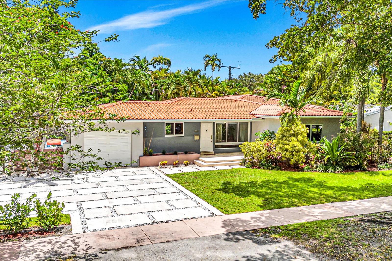 Set on a quiet, tree-lined street, this beautifully updated Coral Gables home sits on a rare double corner lot with lush landscaping & timeless architectural character. Enjoy abundant natural light, impact windows/doors & hardwood floors. A seamless layout with formal living & dining rooms, a large family room, renovated kitchen & baths. The Key West-style backyard is a true oasis, perfect for entertaining or unwinding, featuring a spacious deck, pergola & refreshing dipping pool. The primary suite offers double-door entry, backyard access & a luxurious bath. 1-car garage & ample driveway parking. Fantastic central location just minutes from Miracle Mile, Granada Golf Course, and all that Miami has to offer. Seller financing available.