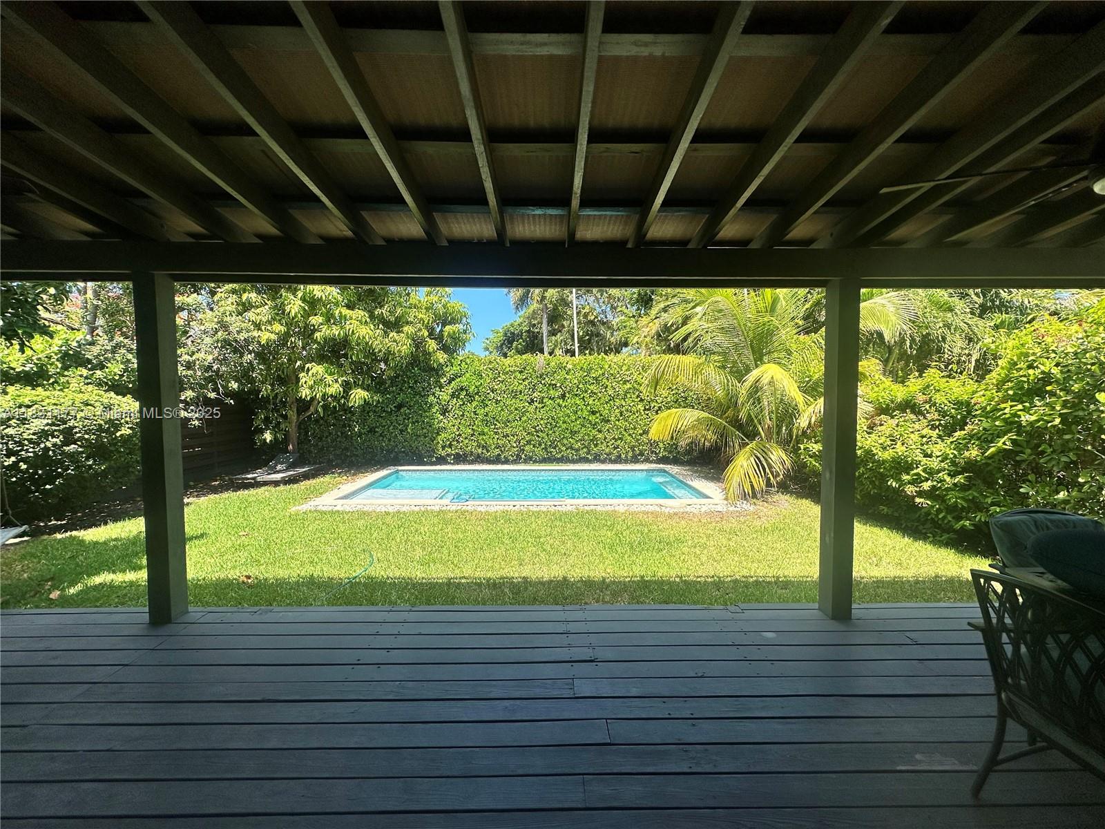 Renovated home with pool, in a quiet neighborhood. Spacious living room, followed by a beautiful dining-kitchen, opened to back yard. Kids corner with 2 bedrooms and a bathroom in one side of the house, and master bedroom with walk-in-closet and bathroom on the other side. Front yard with fruit trees and parking space. Gated back yard with swimming pool and covered patio. Totally renovated, only external walls and beautiful wood floors remain original. New roof, impact windows and new plumbing and electricity. New A/C