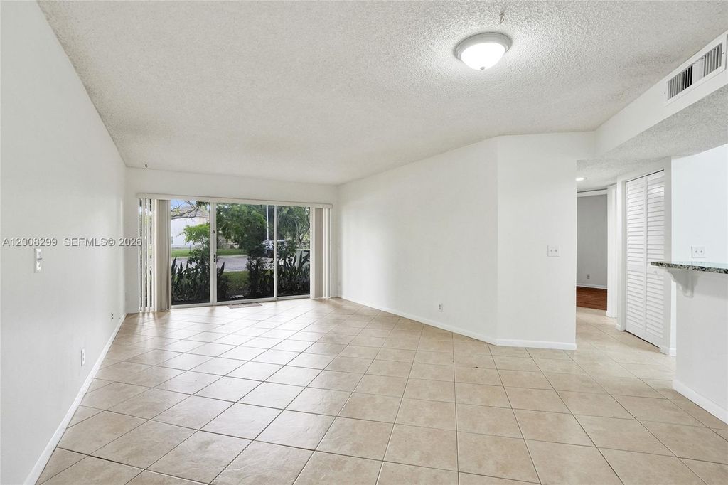 Photo of 8721 Wiles Rd #101, Coral Springs, FL 33067 (MLS # A12008299)