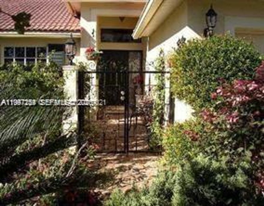 Welcome to this charming 3-bedroom, 2-bath, 2-car garage single-story home featuring high ceilings and a bright, open living and dining area that immediately feels inviting.

Enjoy a peaceful lake backdrop that brings a sense of calm to your everyday living. The spacious eat-in kitchen offers plenty of cabinetry and a comfortable space to gather. Tile flooring throughout and laminate wood in the living areas and bedrooms provide both style and easy maintenance.

The primary suite includes a walk-in closet and a comfortable, private layout. A split floor plan adds functionality and privacy for family or guests.

Nestled within a cozy, gated community, this home offers a quiet and private setting while still being conveniently located just minutes from hospitals, restaurants, shopping, and major roadways. Only a short drive to Downtown Delray Beach.

Lawn care is included, making for easy, low-maintenance living. Easy to show and ready for its next residents.