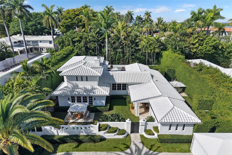 Discover island luxury with this stunning Mid-century modern masterpiece by renowned architect Carlos Schoeppl, renovated to perfection for modern living. Set on a spacious lot in exclusive, guard-gated Sunset Island I with 24/7 security, this estate offers unmatched sophistication and value—being the only home of its size under $10M. Comparable properties and new developments nearby often exceed $15 million, making this a rare and exceptional opportunity. Enjoy exquisite finishes, a gourmet gas kitchen, butler’s pantry, whole-house generator, smart home tech, heated pool, summer kitchen, and 9 Sonos zones for true resort-style living in Miami Beach’s most coveted enclave, at an exceptional price point.