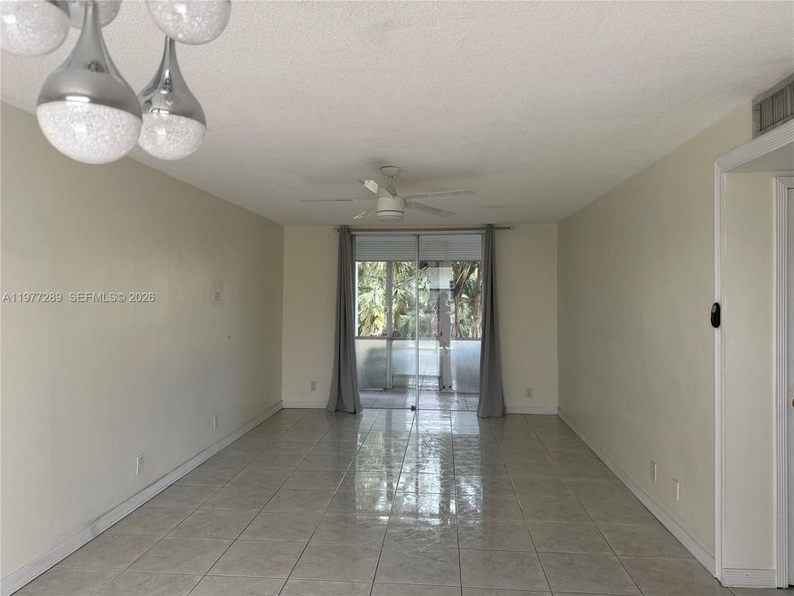 Great 2/2 unfurnished unit on the ground floor, vacant and easy to show.  Tiled and laminate flooring, large screened in porch overlooks lush landscaping and courtyard.  Owner is anxious to sell.  Please call to negotiate!