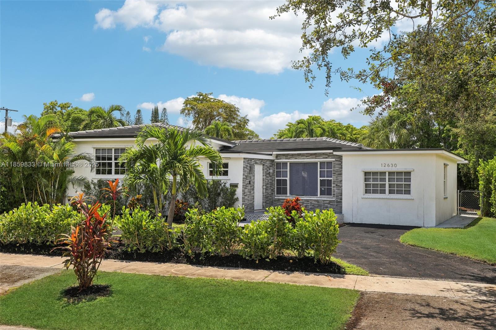 Experience modern living in this fully renovated Mid-Century Modern retreat. Featuring 4 beds, 3 full baths, & 2,380 SF, the home boasts a brand-new slate roof, resurfaced pool, new 5-ton A/C, upgraded electrical, plumbing, kitchen, & 3 redesigned baths. The enormous master suite includes walk-in closet & direct pool access. Step outside into your own private oasis with an immaculate pool, gazebo, & lush landscaping. Entertain family in an open concept floorplan with oversized Italian tile & quartz kitchen with s.s. appliances. Also new flooring throughout, tankless water heater, smart lighting, smart W/D, & security panel. Conveniently minutes from Oleta Park, NoMi Village, Beaches, & Dining. Perfectly situated bt Miami & FtL — all for under $400 per SF!