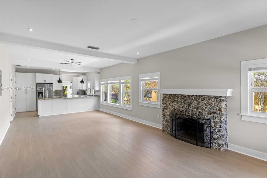 Built in 1922 and beautifully maintained, this timeless Shenandoah residence blends historic character with thoughtful modern upgrades. Centrally located just minutes from Downtown Miami, Brickell, Coral Gables, Coconut Grove, and Miami International Airport, the home offers both charm and convenience in one of Miami’s most sought-after neighborhoods.

The property features its original coral rock foundation and a stunning coral fireplace, preserving the craftsmanship of the era while benefiting from major structural improvements including a stabilized foundation and encapsulated crawl space. Impact windows and doors provide peace of mind, while a newer A/C system and updated appliances—including refrigerator, washer, and dryer—offer modern efficiency.

Inside, the home has been freshly painted and upgraded with brand-new flooring and custom built-out closets throughout. Smart-home features include a HUE lighting system and Ring cameras, and an automatic driveway gate adds privacy and ease.

Outdoor living shines with a brand-new deck overlooking a spacious backyard complete with mature mango and avocado trees and ample room for a future pool—perfect for entertaining or relaxing in your own private oasis.

This is a rare opportunity to own a meticulously cared-for historic home with modern comforts in a premier central Miami location.