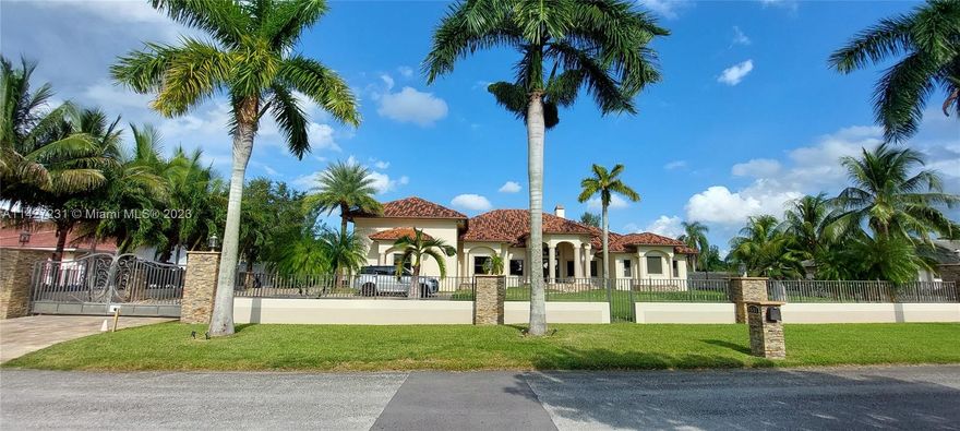 Welcome to this beautiful 7 bedroom custom built home with no expense spared, 12 Foot to 14 Ft High Ceilings throughout entire home, custom pool with waterfall and gazebo, 2 car garage, fireplace, 40k generator, sauna, large covered terrace, 1 acre lot with canal in the back, 500 sq. ft. game room, custom BBQ terrace, basketball court, batting cage, custom fence with electric door opener around the entire home, epoxy floors in the garage, centrally located in The Miramar Ranches, granite countertops, marble floors, security cameras, master bedroom is masterpiece with projector, so many details to mention, take a look at this beauty, LOCATION LOCATION, minutes from I75, shopping, 2 Publix, Pembroke Gardens Mall, Gym, Miramar Hospital within minutes