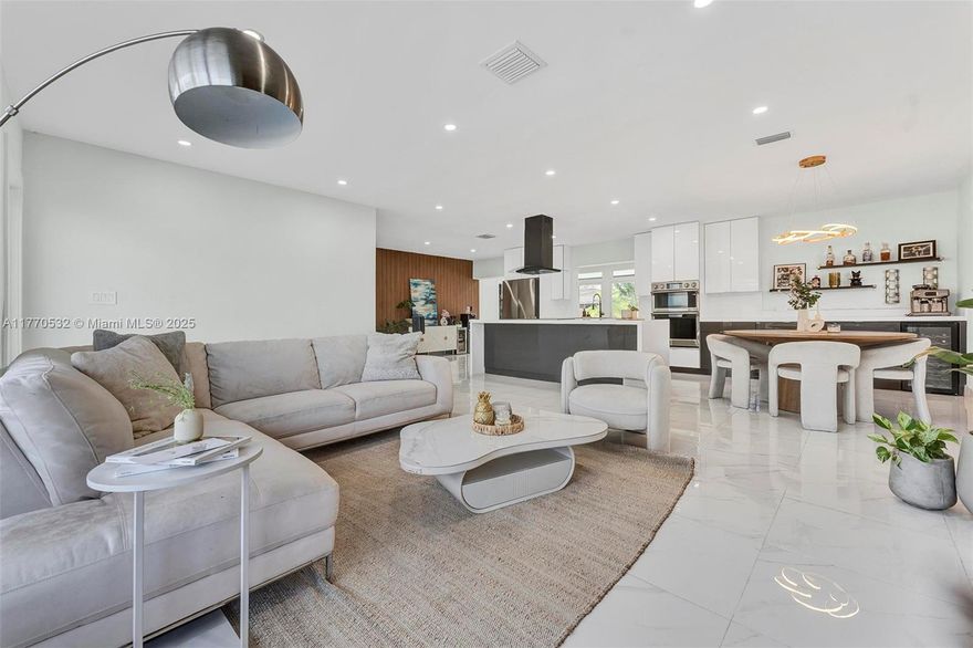Step into the Hollywood Florida lifestyle in this contemporary, open concept 3-bedroom, 2-bath retreat—ideally situated on an oversized 8,750 sq. ft. corner lot just 1.6 miles from the Beach and Hollywood circle. Designed for effortless indoor-outdoor living, the home features an expansive Florida room, a sun-drenched patio, and a sparkling pool perfect for weekend gatherings. Italian-inspired kitchen stuns with a 9-ft quartz island, premium Samsung appliances, and wine bar for entertaining in style. Versatile air-conditioned garage is good for office or multipurpose space! With impact windows and doors, a privacy wood fence, and space to park your boat or RV, this home blends modern design with coastal ease. Easy to show, contact listing agent!
