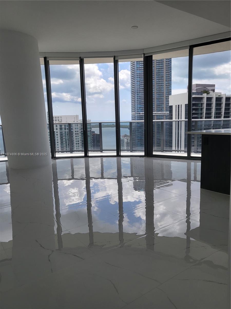 Immerse yourself in the pinnacle of luxury living at Brickell Heights Condominium in Miami. This exquisite 3-bed, 3-bath residence on the 43st floor boasts mesmerizing bay views, while offering unparalleled access to two floors of exclusive amenities. Enjoy leisurely afternoons by the rooftop pool or unwind in the lavish spa. Elevate your fitness routine in the state-of-the-art gym, entertain guests in the private cinema, or host gatherings in the business and clubrooms. With a dedicated kids' room and lush landscapes, every aspect of this address is designed for indulgence and relaxation. Experience urban sophistication redefined.