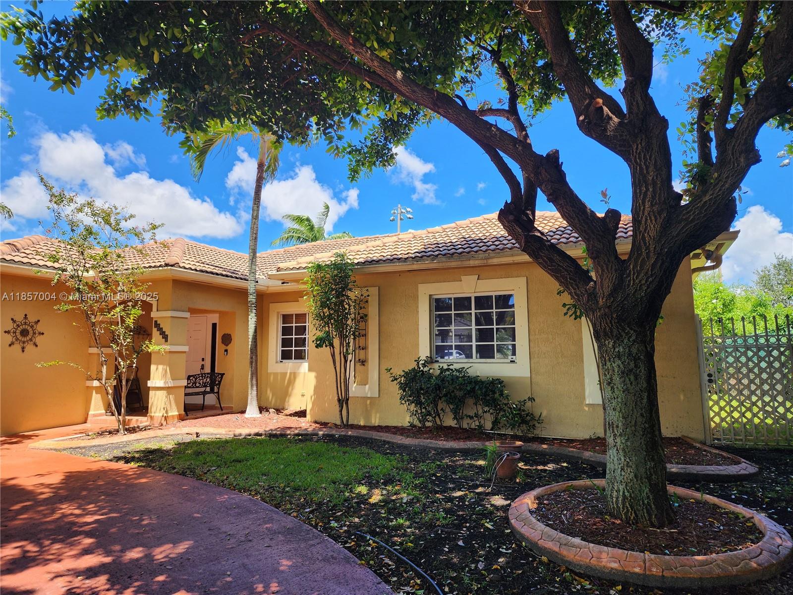 Charming Corner Home in the Heart of Miami Lakes! This spacious 3-bedroom, 2-bath residence sits beside a serene park with a tranquil water fountain, offering a peaceful retreat right outside your door. Enjoy walking distance to the community center and all the neighborhood amenities. Inside, you’ll find an upgraded kitchen with sleek stainless steel appliances, an oversized primary suite featuring a walk-in closet and private en-suite bath, plus generous living areas filled with natural light. Step outside to a screened patio overlooking a beautiful yard with mature trees and no neighbors behind—perfect for relaxing or entertaining. Perfectly positioned and move-in ready—come fall in love!