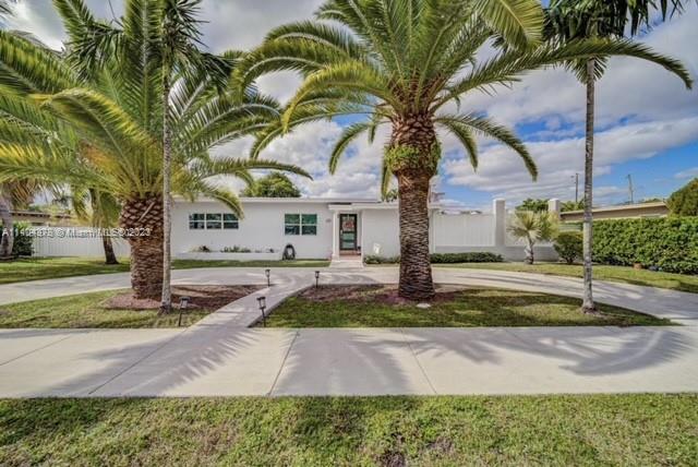 Charming 3/2 home located in the highly sought out area of Westchester. This home sits on over a 10,000 sqft lot with a circular driveway. Aluminum Gates for Privacy. Beautiful Green space backyard with a unique size pool and patio for entertaining family/friends. Custom Built Wood Trellis. Spacious Bedrooms with plenty of closet space. Remodeled Kitchen with Granite Counter-tops and stainless steel appliances. Tile Floors throughout. 8 1/2 Foot Ceilings. Hurricane Impact Windows and Doors. New AC System installed in 2020. Roof from 2015. Freshly painted and immaculately maintained. Property has guest house with private entrance that owner rents out separately!