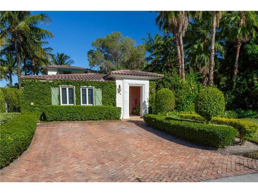 Pristine, private, gated, Mediterranean waterfront oasis. 4 bedrooms, 4 en suite baths, powder room, custom granite/SS kitchen Wolf commercial stove, hurricane shutters, saline pool, 2 loggias, patios, 40 ft. dock, underground wiring, updated 400 AMP elec trical, solar water heater, generator, close to shopping and houses of worship.