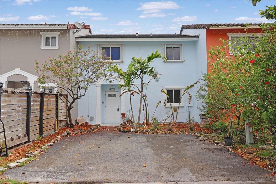 Discover the potential in this spacious 2-story home located in the heart of Homestead with the added freedom of no HOA. This property offers a blank canvas for customization, with a new roof installed in 2021 and hurricane shutters for full storm protection. The layout features two bedrooms, each thoughtfully designed with its own en-suite bathroom for ultimate privacy and convenience. The interior transitions seamlessly into a cozy backyard, already blooming with banana and papaya trees, making it the perfect start for a private tropical retreat or a weekend BBQ spot. Situated in a prime location near local shops and schools, this home offers a functional floor plan and unbeatable proximity to everyday essentials. Homestead is the end of mainland Florida at the entrace to the Florida Keys offering a quick drive to your favorite tropical resorts. For Nascar enthusiates, the Homestead Racetract is minutes away.  For native fruit and vegetable lovers, visit Robert Is Here fruit stand, petting zoo and spash park for the best selection of exotic delicacies.  Priced according to need for floor finishings. Bring your vision and capitalize on this high-potential find!