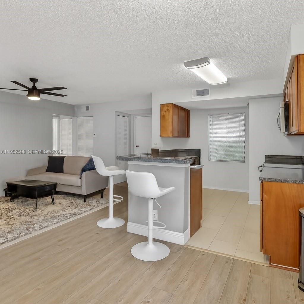 Photo of 9999 Summerbreeze Dr #401, Sunrise, FL 33322 (MLS # A11952590)