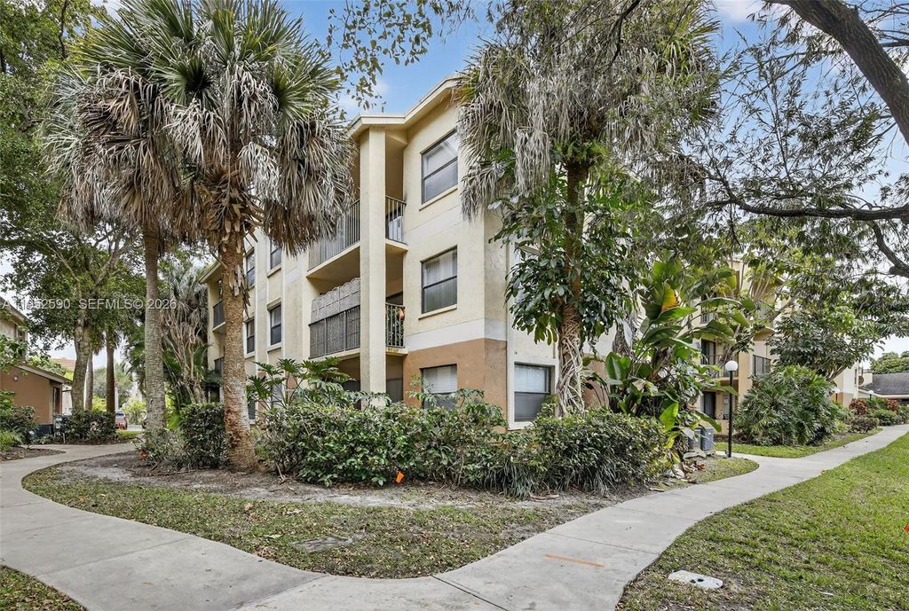 Photo of 9999 Summerbreeze Dr #401, Sunrise, FL 33322 (MLS # A11952590)