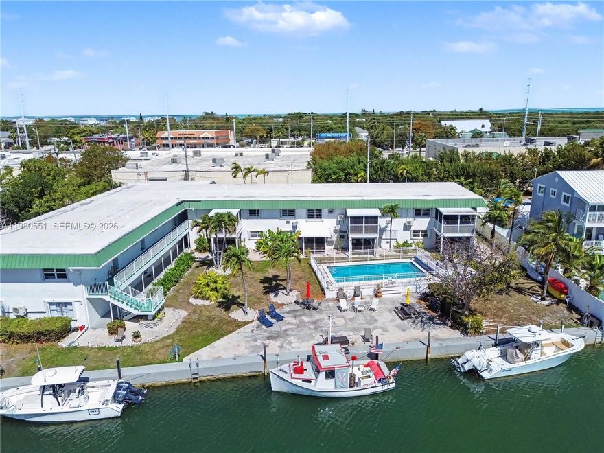 Boater's paradise in the heart of Marathon ! Beautifully furnished 2 bed 1 bath waterfront condo featuring stunning canal views and the perfect Florida Keys lifestyle with a private screened terrace ideal for enjoying breezes and unforgettable sunset views.
The community offers deep-water dockage accommodating vessels up to 28 ft.Residents also enjoy the heated pool,BBQ area and relaxing outdoor spaces.Located just minutes from beaches, restaurants ,shops and local attractions , this property offers excellent appeal as a vacation gataway or income producing investment as a vacation rental  in one of the key's most sought after boating destinations. Seller financing may be available for qualified buyers creating an opportunity for investors or second home buyer.