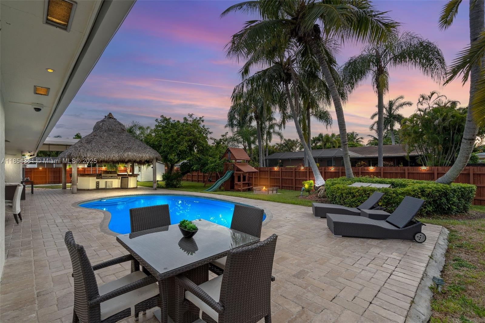 Welcome to your slice of Palmetto Bay living — where every day feels like a staycation! This spacious 4-bedroom, 2-bath pool home was made for both relaxing and entertaining. Formal living & dining room, cozy family room right off the kitchen, plus impact windows & doors throughout for peace of mind. Outside you’ll find a sparkling saltwater pool, tiki hut with a built-in grill for endless BBQ nights, and a playground for the kids. Need storage? You’ve got two sheds. Feeling competitive? Large concrete pad perfect for your RV, a quick basketball game, or roller-skating under the stars. All of this in the heart of Palmetto Bay — a golf-cart-friendly, close-knit community known for family fun, parks, and that small-town charm just minutes from the city.