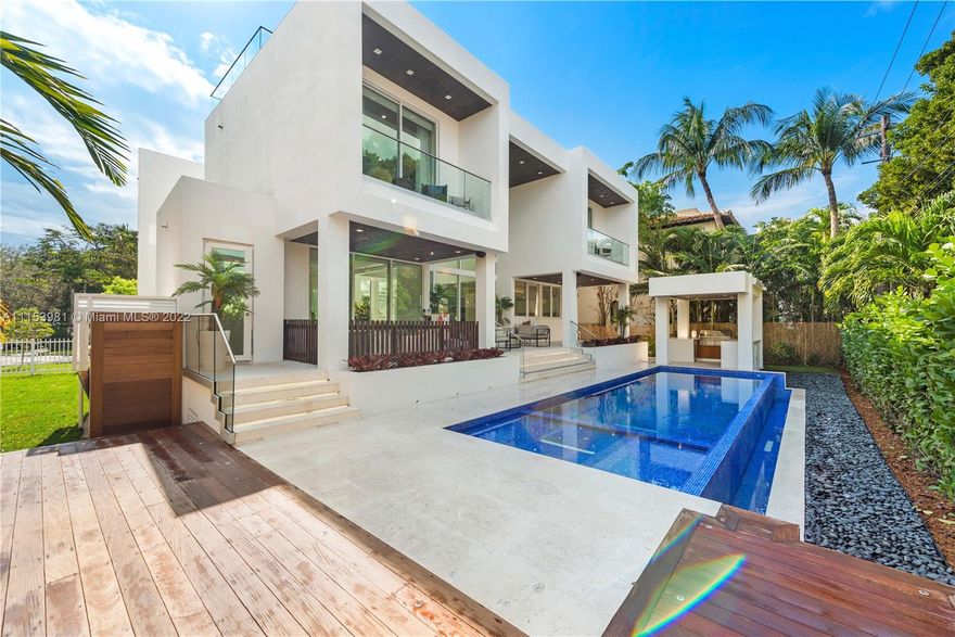 This brand new, modern luxury corner-lot home in Key Biscayne was built in 2020 with architectural design by award-winning Architect, Jose Sanchez. Fully upgraded in 2021 with an all-new kitchen equipped with top-of-the-line Wolfe appliances, new stairs, new backyard wood deck, new summer kitchen, custom wood slat wall accent, landscaping and more, no detail has been spared in creating this unique 3-story home. Stylishly designed with a well thought out layout and finished in the finest fashion, 201 Buttonwood Dr epitomizes luxury living. Standout features include a pool surrounded by an abundance of outdoor space and an expansive rooftop terrace showcasing views of Downtown Miami and the ocean. 201 Buttonwood Dr makes it easy to savor the bay breeze and embrace the Key Biscayne lifestyle.
