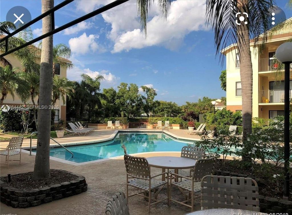 Photo of 9999 Summerbreeze Dr #218, Sunrise, FL 33322 (MLS # A11984442)