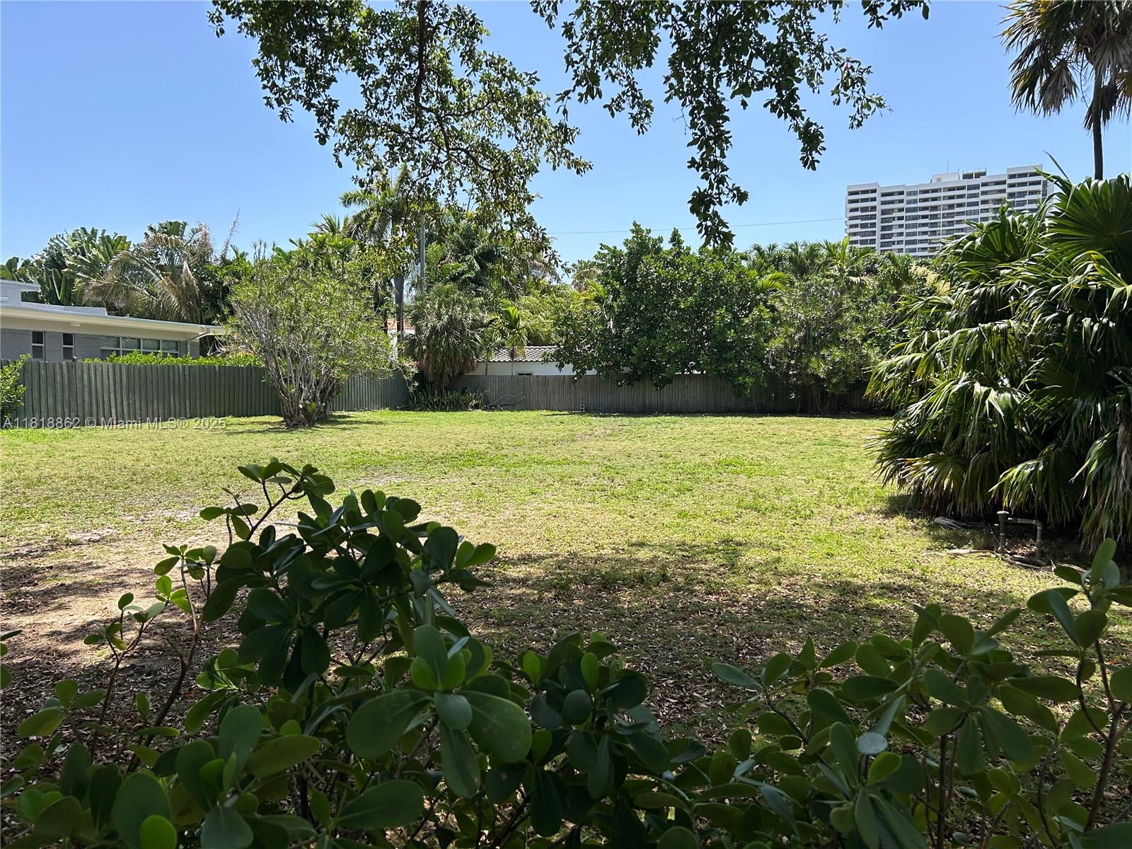 Build your dream home on a rare double lot in the heart of Miami Beach, located off Pine Tree Dr in a private enclave on Flaming Place. One side of the property has a 5040 sqft mid-century modern one-story home with a garage, spacious front yard, a circular driveway, plus a big backyard with plenty of room for a pool and entertaining. The huge 20,800 sqft lot can be sold as one property or split. The quiet tree-lined street is near a pedestrian bridge connecting to beach access, close to dining, shops, markets, Sunset Harbor, Lincoln Road, the 1 Hotel, schools, a new public park, the Hebrew Academy, Youth Center with an Olympic pool and ice rink. Don't miss this rare opportunity to own a piece of Miami Beach's prime real estate on one of the highest elevated streets in the city.