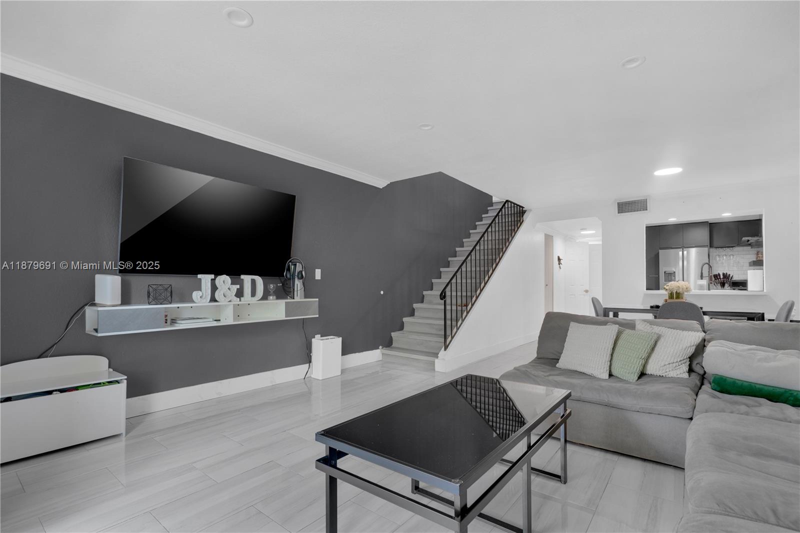 Welcome to Puerta Del Sol! This updated two-story condo features a brand-new kitchen with quartz counters and subway tile backsplash, plus hurricane impact windows & doors throughout. The main level offers ceramic tile floors, while upstairs boasts modern LVP flooring. Enjoy 1.5 baths, in-unit washer & dryer, and two private balconies for outdoor living. The community provides convenience with one assigned parking space plus visitor decal and water included in the HOA. A perfect blend of comfort and style in a desirable location!