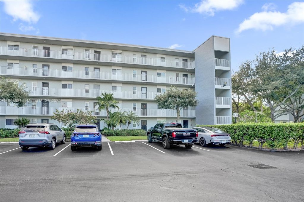Photo of 2220 N Cypress Bend Dr #310, Pompano Beach, FL 33069 (MLS # A11908681)