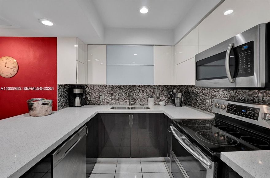 Spectacular water and Golf Course view in a tree story Townhouse Located at the Country Club of Miami 3 full bathroom / 3 bedroom, SS appliances, Washer and Dryer, balcony, patio, plenty of storage. Gated Community. Two Tandem Parking space and guess Parking