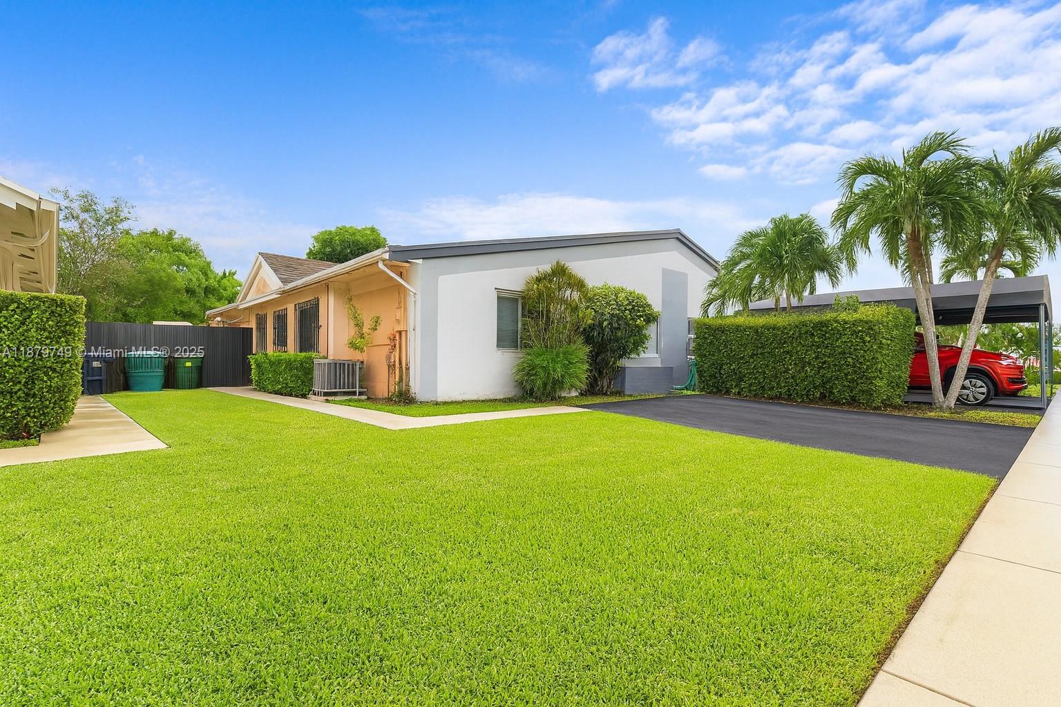This Beautifully updated and cozy 3-bedroom, 2-bath home offering comfort, style, and peace of mind. Upgrades include a new roof, hurricane-impact sliding doors, modern A/C, and water heater for lasting efficiency. The bright open layout features a sleek kitchen with granite countertops and seamless flow to living and dining areas. Multiple gathering spaces — breakfast bar, dining room, and TV room — provide flexibility. Spacious bedrooms, including a private master suite, offer room for the whole family. Outdoors, enjoy a covered patio (with permit), new fence, and plenty of space to relax or entertain. With no HOA fees and a quiet, family-friendly location near A-rated schools, shopping, parks, and dining, this home is truly move-in ready.