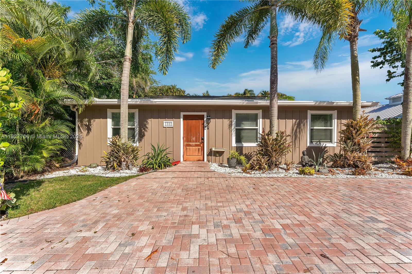 PERK: Ultra low electric bills--typically just $20-$40 per month.Rare opportunity to own one of the few no HOA homes in Jupiter on an oversized 10,133 sq ft lot. This charming 3-bedroom, 2-bath starter home offers great potential for first-time buyers, investors, or as a vacation rental. The layout is functional and inviting, featuring a recently enclosed patio with hurricane impact windows, a metal roof, new flooring, new water heater and a new AC. The spacious lot allows room to expand, add a pool, or park a boat/RV--no restrictions. Ideally located just 10 minutes from the Beach, 5 minutes to Publix, shopping, and dining, and under 10 minutes to top-rated schools. Only 15 minutes to Brightline West Palm and with quick access to I-95 and US-1. A rare find in an unbeatable location.