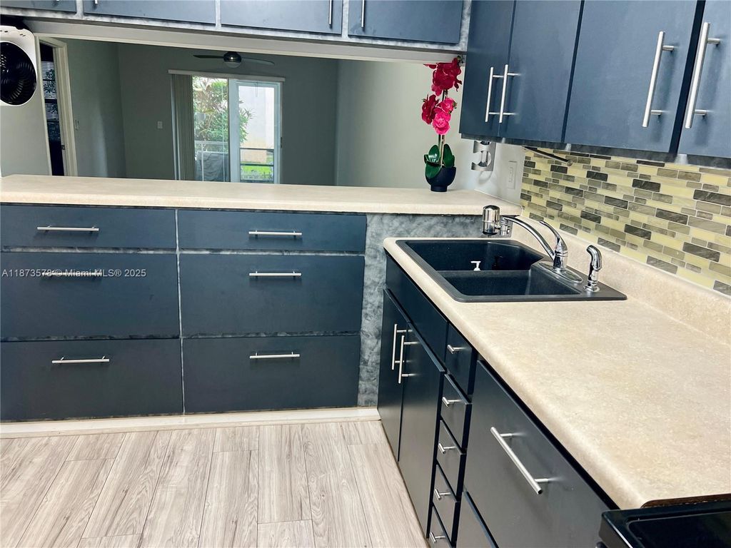 Photo of 7610 Stirling Rd #103B, Davie, FL 33024 (MLS # A11873578)