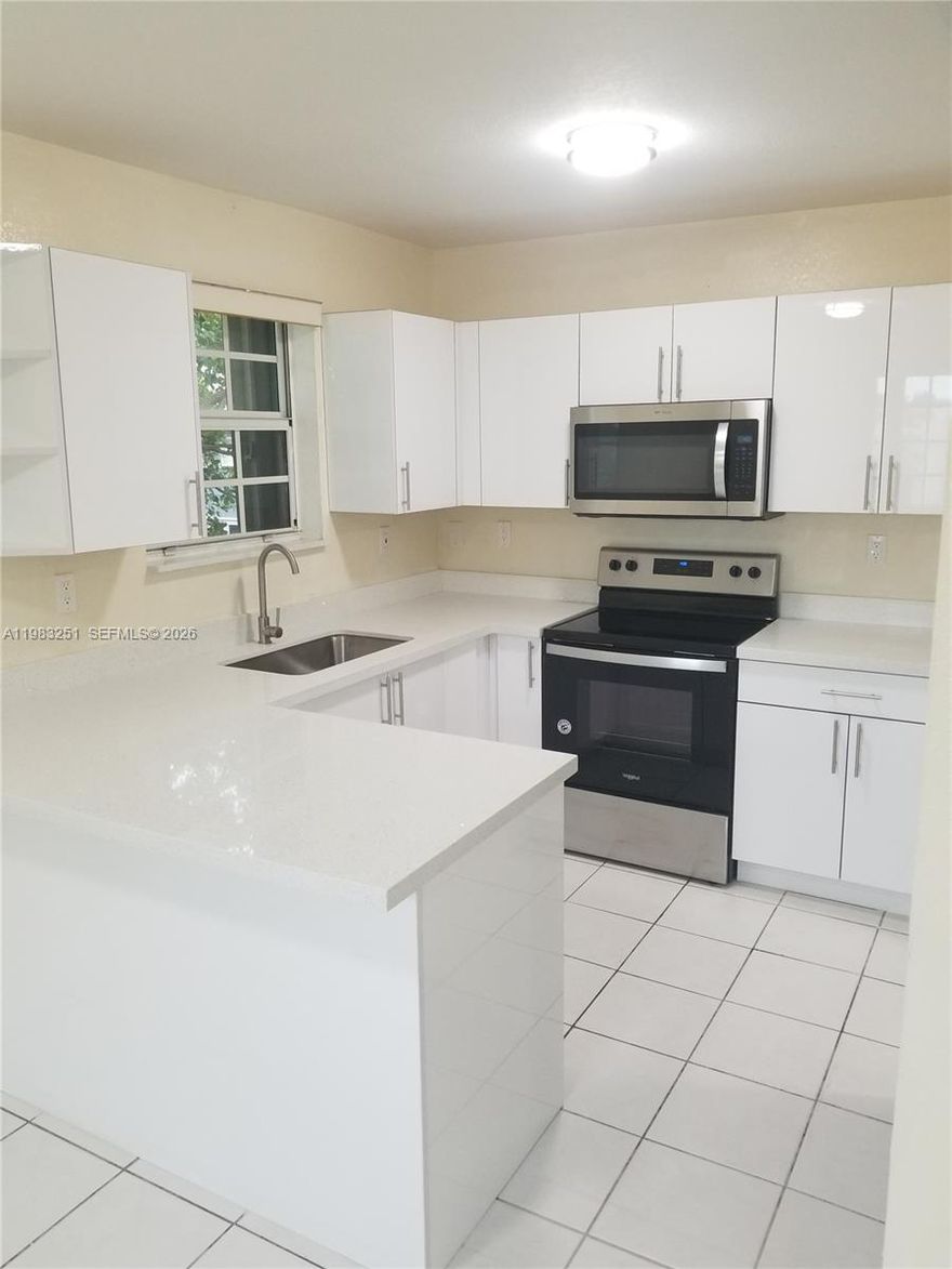 Beautifully remodeled 3 bedroom, 2 bath apartment in a quiet neighborhood in North Miami, close to all major shops and transit roads. This is on a quiet dead end street. Quartz countertops, stainless steel appliances and washer and dryer in unit. 2 assigned parking spaces included along with ample additional street parking. This unit is on second floor of a fourplex with peaceful long term neighbors. Please see ALL PHOTOS. Section 8 welcomed.