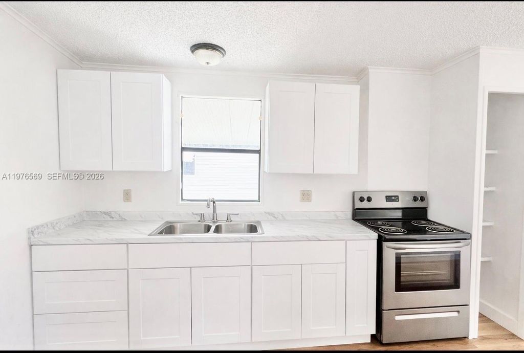 Photo of 6156 Seashore Drive, Atlantis, FL 33462 (MLS # A11976569)