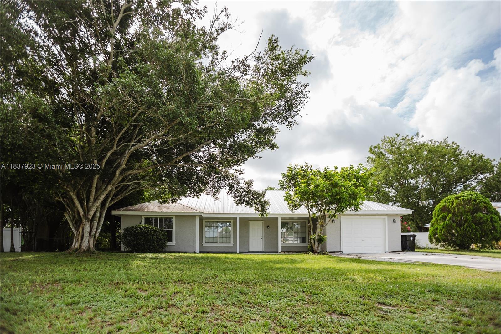 Welcome to 274 SW Bridgeport, a beautifully maintained 3-bedroom, 2-bathroom home located in the heart of Port St. Lucie. This charming residence offers an open-concept layout with spacious living and dining areas, perfect for both relaxing and entertaining. The kitchen features granite countertops, stainless steel appliances, a subway tile backsplash, and a large breakfast bar overlooking the living space. Enjoy outdoor living in the private, fully fenced backyard with a patio ideal for barbecues or simply enjoying the Florida sunshine. Conveniently located near schools, shopping, dining, I-95, and a short drive to beaches and parks, this move-in-ready home offers the perfect blend of comfort, style, and location. Don’t miss this opportunity!