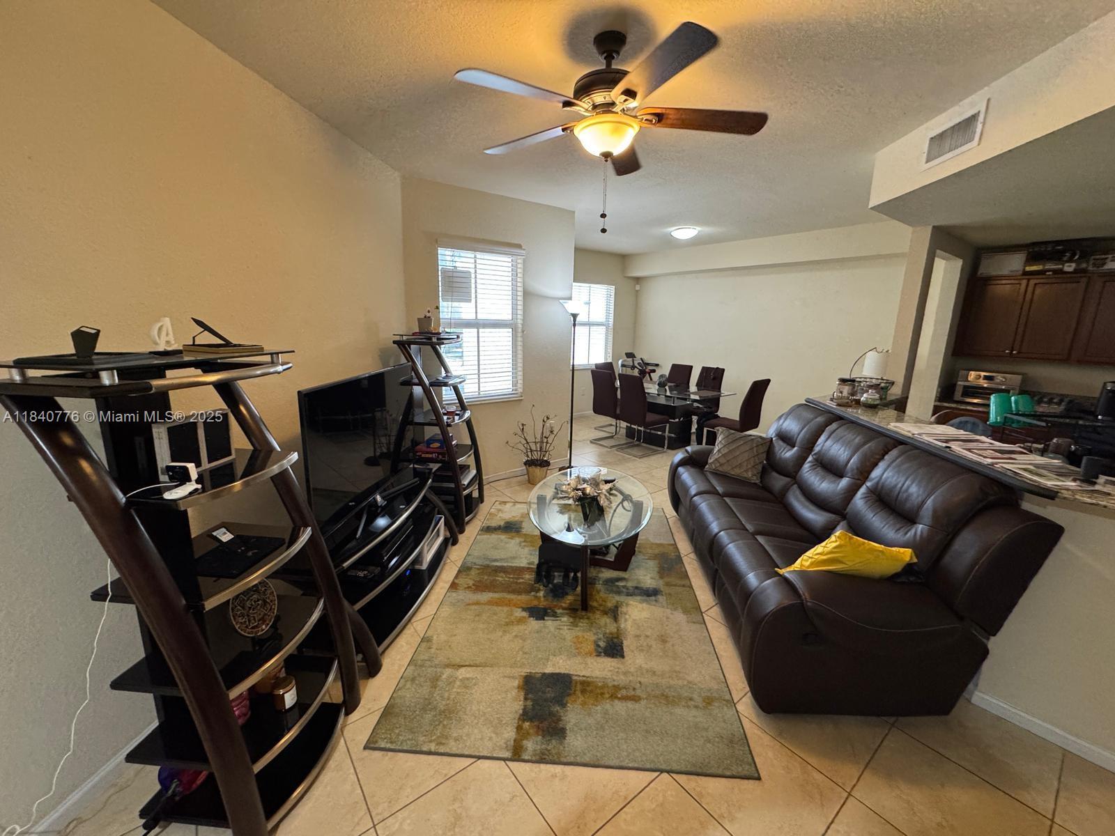 Located in the heart of Doral, Florida, 11603 NW 89th St #215 is a stunning 2-bedroom, 2.5-bath condominium that seamlessly blends modern convenience with comfort. This spacious unit features an open floor plan with abundant natural light, a fully equipped kitchen with stainless steel appliances, and a cozy living area perfect for relaxing or entertaining. The generous bedrooms offer ample closet space, while the master suite includes an en-suite bathroom for added privacy. Residents enjoy a range of amenities, including a sparkling pool, fitness center, and clubhouse, all within a secure, gated community. With easy access to major highways, shopping centers, and restaurants, this is an ideal home for those seeking both luxury and convenience in a prime location.