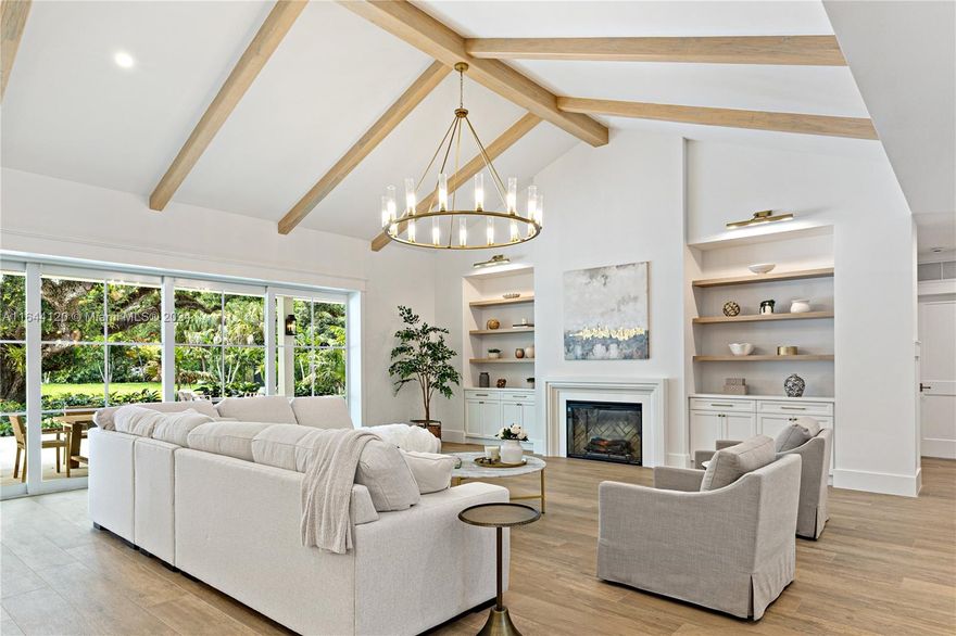 The newly built Villa Coral is a brand-new masterpiece of custom craftsmanship with vaulted & coffered ceilings, custom built-ins, wainscoting, and more. 5 en-suite bedrooms, 6.5 baths, plus a spacious office, gym, and game room. The dream kitchen features custom cabinetry, Thermador appliances, a gorgeous walk-in pantry and breakfast nook. The formal dining room features a stunning built-in bar. A big laundry room equipped with double towers and pet shower. The luscious acre lot features rare botanical wonders and offers 2 covered terraces, outdoor kitchen, fire pit area and a large pool & spa. Additional features include a triple car garage, full house generator, security system, outdoor speaker & lighting system and more. Adjacent to the Ludlam Trail. Designed and built by Porta Negra.