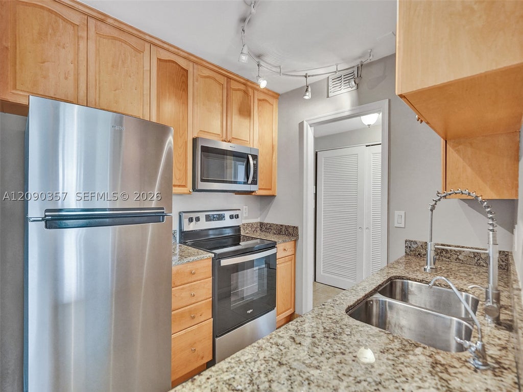 Photo of 400 N Riverside Dr #303, Pompano Beach, FL 33062 (MLS # A12090357)