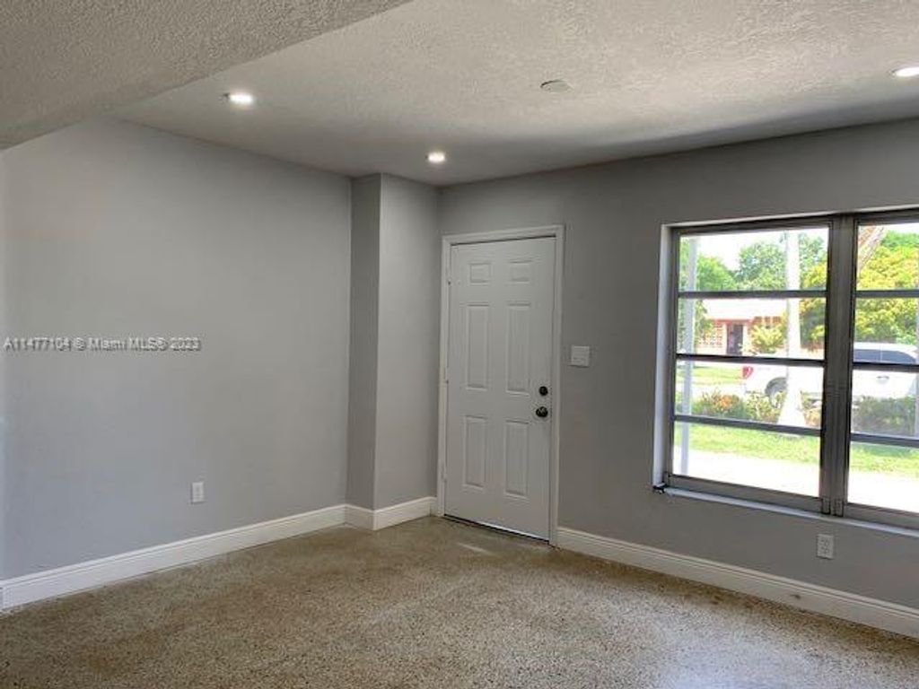 Photo of 326 E Ilex Dr, Lake Park, FL 33403 (MLS # A11477104)