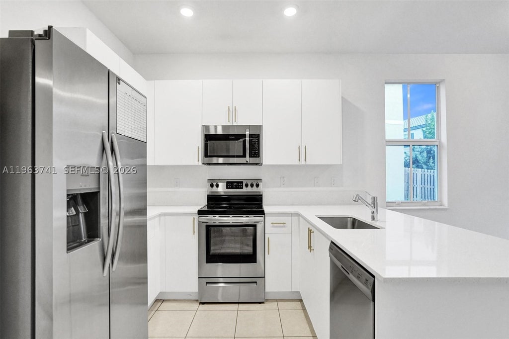 Photo of 11920 NW 47th Mnr, Coral Springs, FL 33076 (MLS # A11963741)