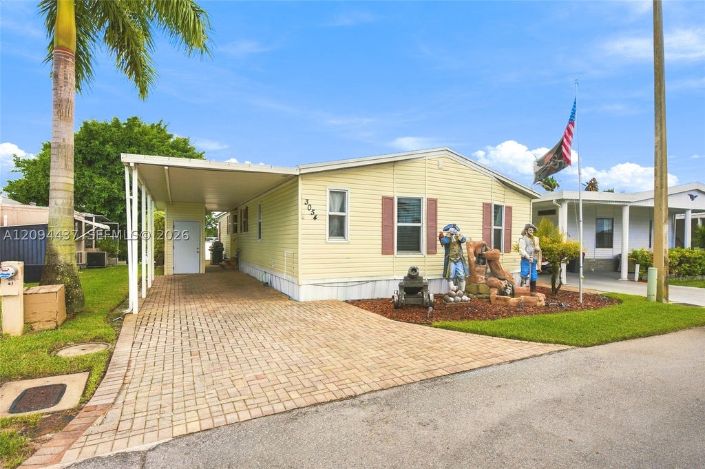 Photo of 3054 Lakeshore Dr, Dania Beach, FL 33312 (MLS # A12094437)