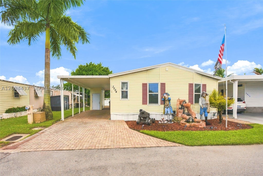 Photo of 3054 Lakeshore Dr, Dania Beach, FL 33312 (MLS # A12094437)