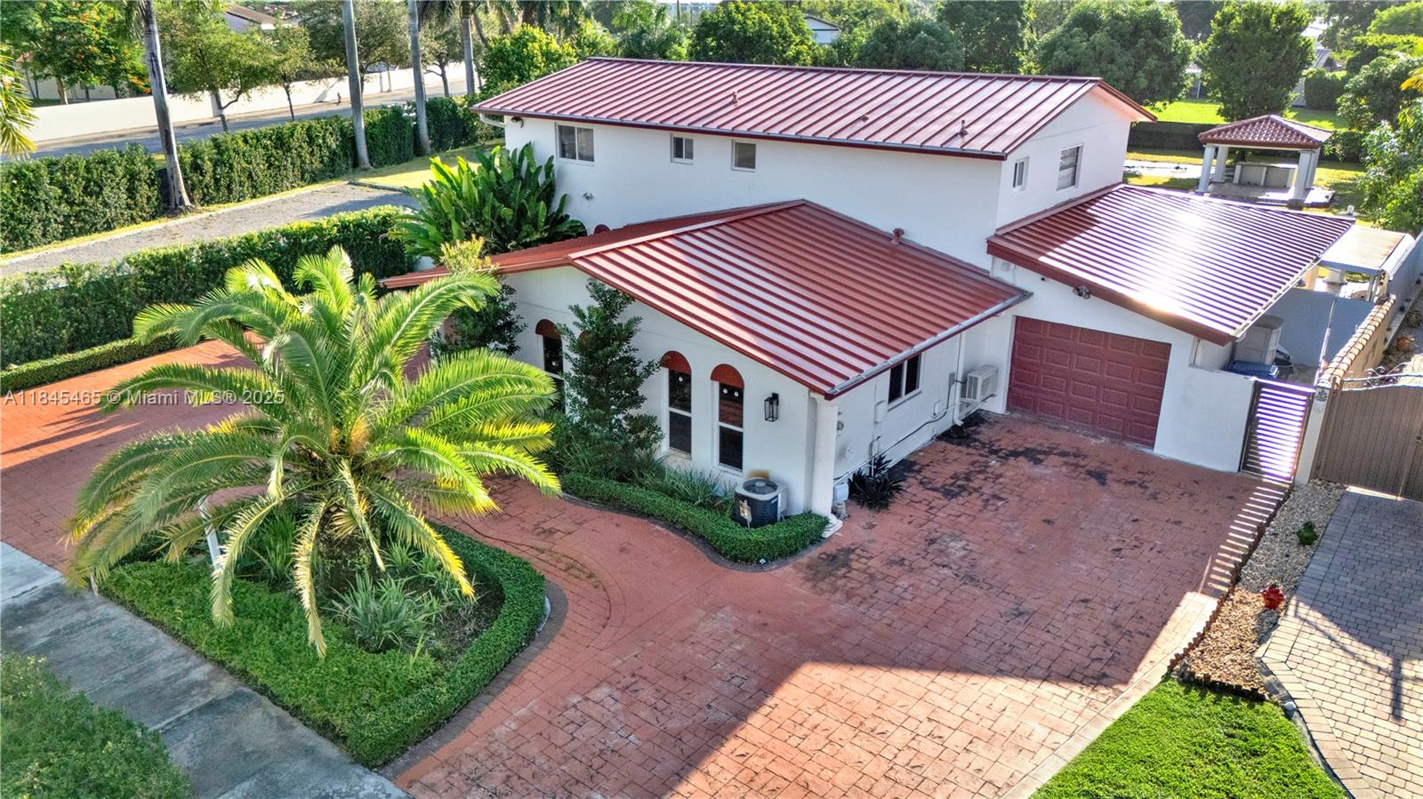 Beautifully updated 4BD/3.5BA home with 3,353 sq ft on a 0.75-acre lot in Miami. Features include a 2021 metal roof, full impact windows, EV charger, new electric gate, 2023 kitchen appliances, washer/dryer, and AC. Spacious yard with fruit trees, grill island, pergola, and large pad for RV or extra parking. State-of-the-art surveillance system and fresh exterior paint. Move-in ready with modern upgrades throughout—perfect for comfortable living and entertaining.