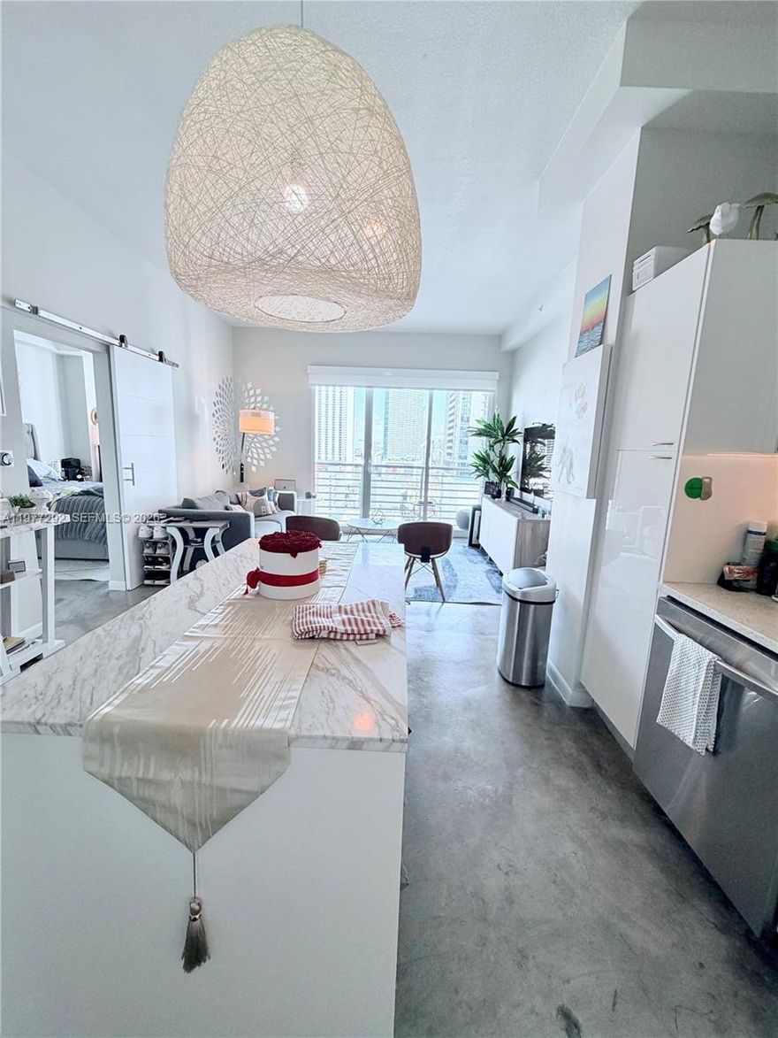 Stylish loft in vibrant Downtown Miami featuring soaring ceilings and a bright open layout converted to 1BR. Meticulously owner-maintained, with a skyline-view balcony and new appliances. Resort-style amenities and steps from Miami Worldcenter and Kaseya Center.